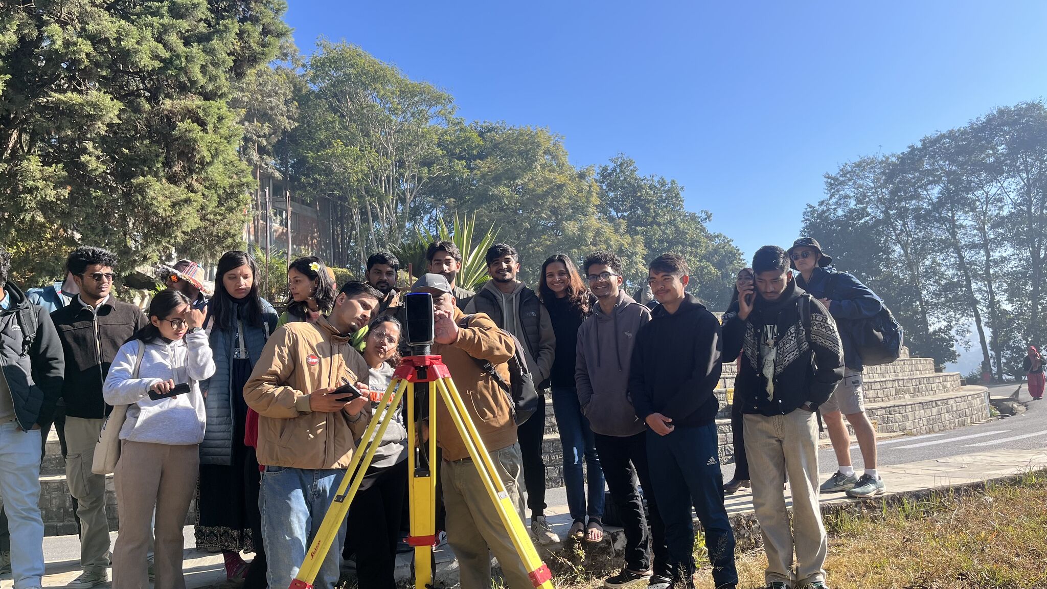 Students working with survey equipment during the New Colombo Plan program